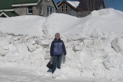 Diana giving prospective to how much snow is piled up on the streets of CB