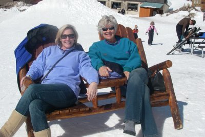 Marina and Diana sitting at the base of the mountain.