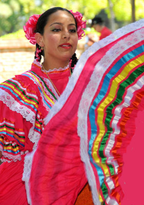 A different dancer twirling her skirt expertly!