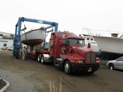 Travelift lifting ROGUE ANGEL off transporter