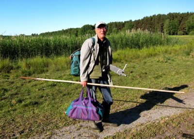 Leif has all necessary banding equipment in hand -- mist nets, poles, processing tools, even a stool built into his backpack.