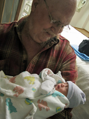 Holding newborn Gavin Anderson Ngim