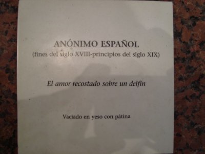 El amor recostado sobre un delfn