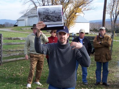 Garry Adelman Showing Photo of Mumma Farm