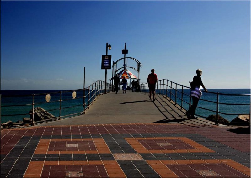 Looking at those walking up the jetty
