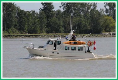 Yacht heads upriver.