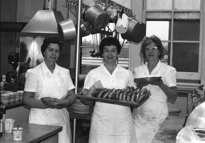 SCS Kitchen Staff with health food for the 1960/70's students