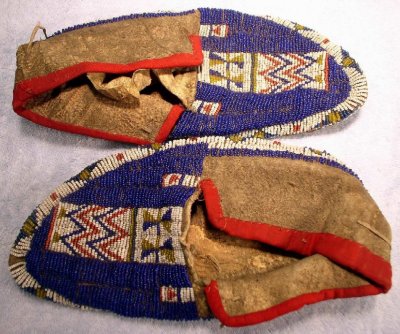 Burtt is holding these moccasins in his hands in the previous photo.