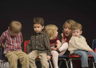 Mom had to stay on stage with her son or else he was gonna leave.