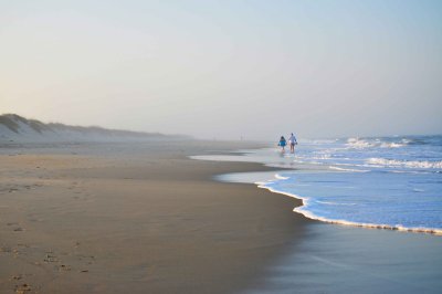 Walk on a foggy beach