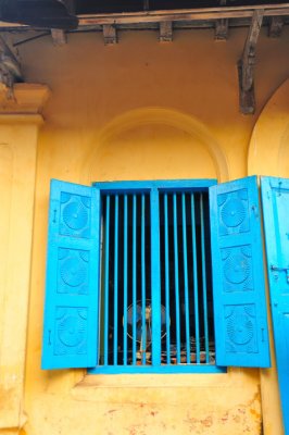 Yellow house blue window