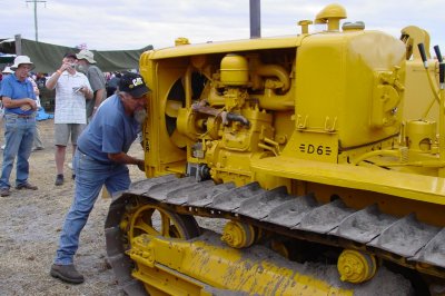 Stuss Eatts cranking the starting engine into life on his late 1930's, 2H series, 3 cylinder D6. I must admit I was rather surprised at the massive firing stroke thumps on this old 5 bore x 8 stroke engine. It vibrated the sandy ground, running at a fast idle. These old Cat engines only do 850RPM at full speed.