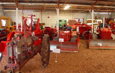 Part of the International collection in the International Shed, showing a range of IH crawlers, trucks, a Scout, and a Wheeltractor.