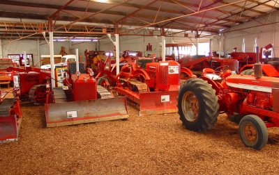 Another view of part of the impressive collection of IH wheeltractors, crawlers, and IH trucks in the IH shed.