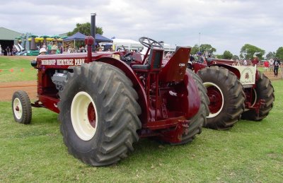 The two, highly modified, Chamberlain tractor pullers, side by side.
