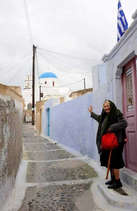 Santorini. Village of Pirgos. An elderly woman invite us to visit Venetian castle