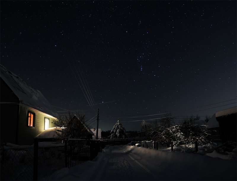 Orion constellation (brightest stars in the center) and a falling star (dash near the wires)