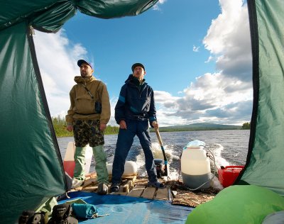 Valera and Lesha on duty while sailing by the Kureika river