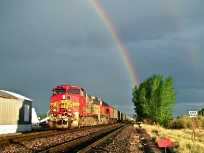 The BNSF grain train at Townsend, MT with a double rainbow in the sky. 5/29/09