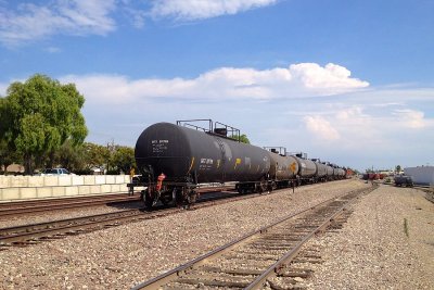 Monsoon thunderheads seen in the distance as the train passes la Mirada Yard.
