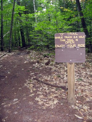 Signage that converts to closed when trails are wet