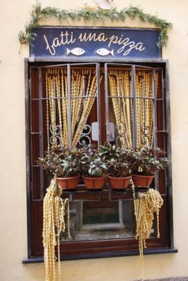55.  Along Il Carrugio.  Drapes of pasta shells.