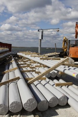 42.  The new pilings stacked up for installation.