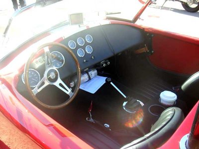 The cockpit is all business, aside from the cup holders