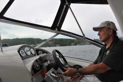 Captain Dennis at the helm