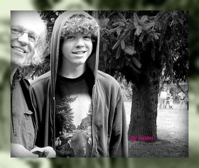 father and son with mirrored frame