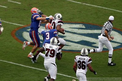 Florida Gators QB Tim Tebow takes a Gamecock after a fumble