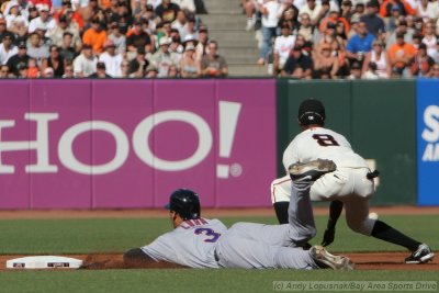 New York Mets SS Alex Cora slides safely into second base
