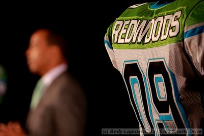 The California Redwoods away jersey with UFL commissioner Michael Huyghue in the background