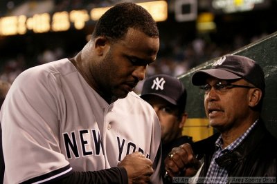 New York Yankees pitcher C.C. Sabathia gets a fist bump from MLB HOFer Reggie Jackson
