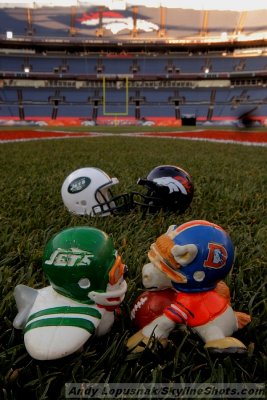 NFL Huddles: NY Jets & Denver Broncos huddles figures at Invesco Field in Denver