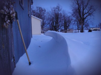 Sidewalk (unshoveled) from parking area to the house. Pump house on left. (2/2/11 evening)