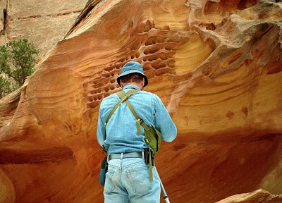 W. photographing Pitted Sandstone - Utah
