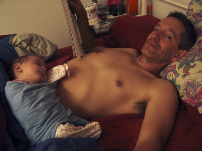 Sleeping on Papa's Belly.JPG