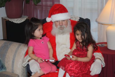 Sophia & Angelez with candy from Santa