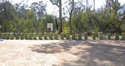 22 recycle bins, all in a row - More or less in the middle of nowhere