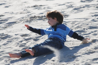 Carter tumbling down the dunes