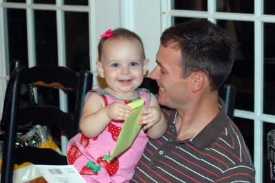 Addy helps her Daddy open his presents