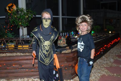 Brooks and Hudson in front of a Halloween train station
