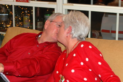 Momma kissing Santa Claus