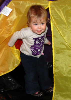 Avery peeking out from Jonah's tent