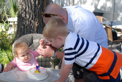 Maddox helps to blow out the candle