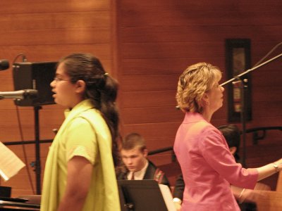 With the choir behind her
