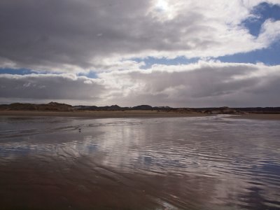 Stream empties on highway that is the 90 mile beach