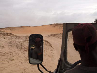The kid driving our vehicle over the dunes