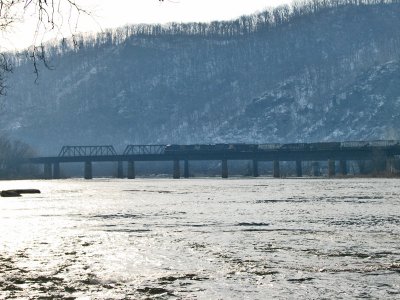 Freight train crosses the Potomac as the sun rises